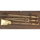 A brass three piece fireside companion set, 76cm,