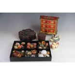 A collection of Chinese objects, including scroll pictures, figures of Immortals, tea pots,