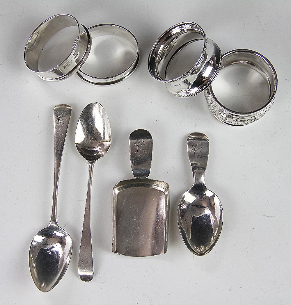 A pair of silver napkin rings, Birmingham 1938, along with two further napkin rings,