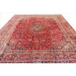 A large hand woven wool carpet,