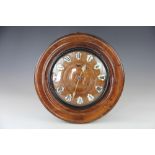 A late 19th century German oak wall clock,