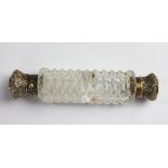 A Victorian cut glass and silver gilt mounted double ended scent bottle,