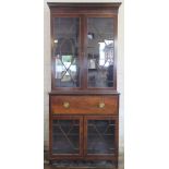 A Regency mahogany and boxwood line inlaid secretaire bookcase,