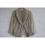 A lady's white mink fur jacket,