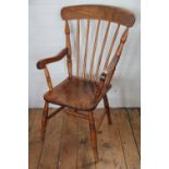 A 19th century beech and ash country kitchen chair, with turned spindle back and solid seat,