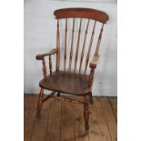 A 19th century beech and ash country kitchen chair, with turned spindle back and solid seat,