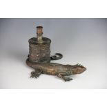A Victorian table lighter/smokers companion, in the form of a lizard,