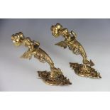 A pair of Victorian cast brass gas wall lights, converted for electricity,