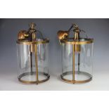 Three modern bronzed metal hall lanterns, of cylindrical form, and a larger two light example,