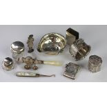 A collection of silver and white metal items, to include a silver napkin ring with shell finial,