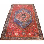 A Caucasian hand woven wool carpet,