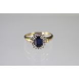 A sapphire and diamond oval cluster ring,