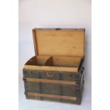 A vintage wood and metal bound canvas mounted steamer trunk, with original internal tray,