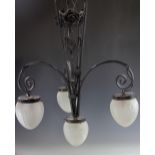 An Art Deco style painted metal four light ceiling llight, with frosted and moulded shades,