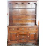 A George III style oak and walnut banded high back dresser,