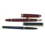 A Montblanc Meisterstuck fountain pen, in burgundy with 14K nib,