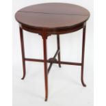 An Edwardian inlaid mahogany drop leaf side table, with small under tier, on out swept legs,