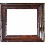 An 18th century and later walnut cushion frame mirror, with bevelled plate,