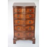 A reproduction mahogany serpentine pillar chest, with five graduated long drawers, on bracket feet,