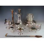 A collection of 19th century and later silver plated wares, to include a pair of candlesticks,