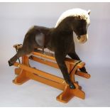 A Merrythought soft toy rocking horse,