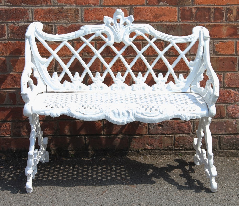 A Coalbrookdale style cast iron garden bench, with trellis back and foliate scroll frame, - Bild 2 aus 2