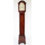 An Edwardian mahogany chiming grandmother clock,