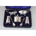 A silver condiment set, Atkin Brothers, Sheffield different dates to include 1904 and 1910,