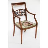 An Edwardian carved and inlaid mahogany salon chair in the manner of Edwards and Roberts,