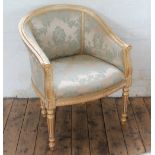 A modern Louis XVI style gilt wood salon tub chair, with foliate blue upholstery,