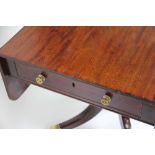 A 19th century mahogany Pembroke table, with drawer, on turned column and out swept legs,