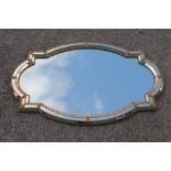 A modern gilt brass and glass wall mirror,