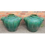 A pair of squat vases, Chinese / Korean, with a sage green crackled glaze and lion head mounts,