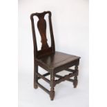 A late 17th century oak chair, with vase shaped splat and solid seat,