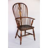 A 19th century ash and elm Windsor type chair, with hoop back and solid seat on turned legs,