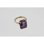 An amethyst set dress ring,