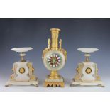 A late 19th century gilt brass and onyx clock garniture,