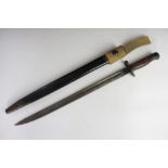 A 1907 pattern Military Issue bayonet with scabbard and canvas strap, 57.