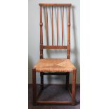 An 18th century country oak chair, possibly Lancashire, with turned uprights and tapered spindles,