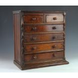 A Victorian mahogany apprentice chest, with two short and four long drawers, with turned handles,