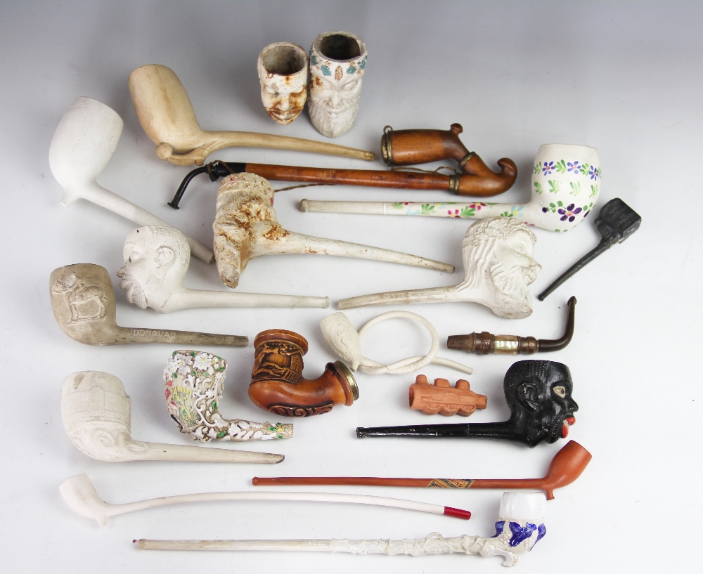 A collection of 19th century clay pipes, including one with a Jockey impressed Donovan,