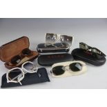 A collection of five designer sunglasses,