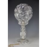 An early 20th century cut glass desk lamp, with spherical shade,