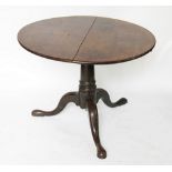 A George III mahogany circular occasional table, on tripod base and pad feet,