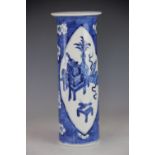 A Chinese blue and white sleeve vase, decorated with panels of antiques against a prunus ground,