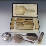 A silver and yellow enamel five piece dressing table set, Birmingham 1929, cased,