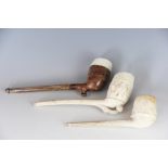 Three 19th century clay pipes of large size, comprising an International Exhibition 1862 example,