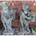 Two reconstituted stone garden figures of cherubs, emblematic of the arts,
