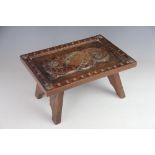 A Welsh carved walnut stool,