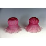 A near pair of Art Nouveau graduated cranberry to clear frosted glass light shades,